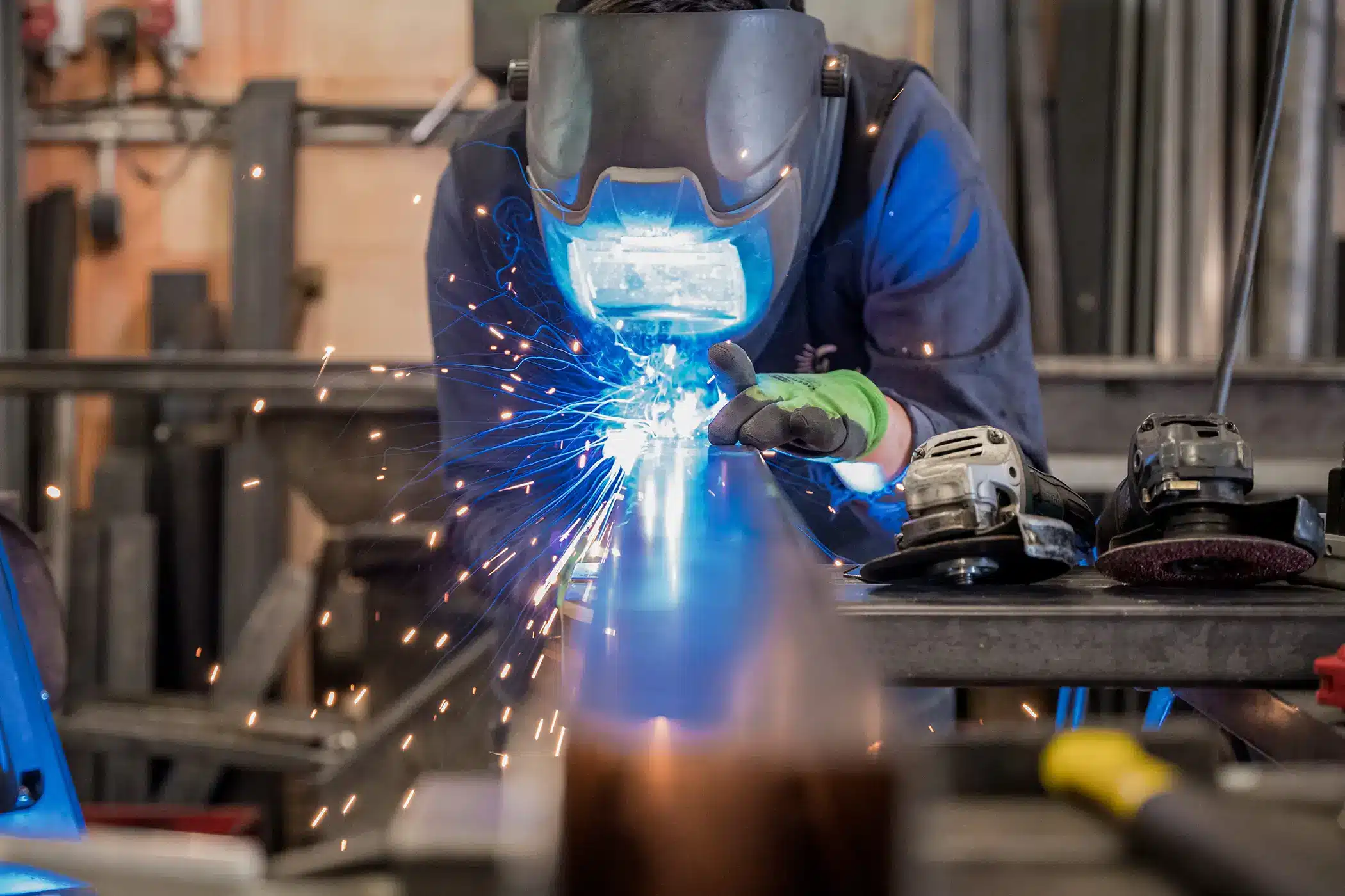 worker while doing a welding with arc welder