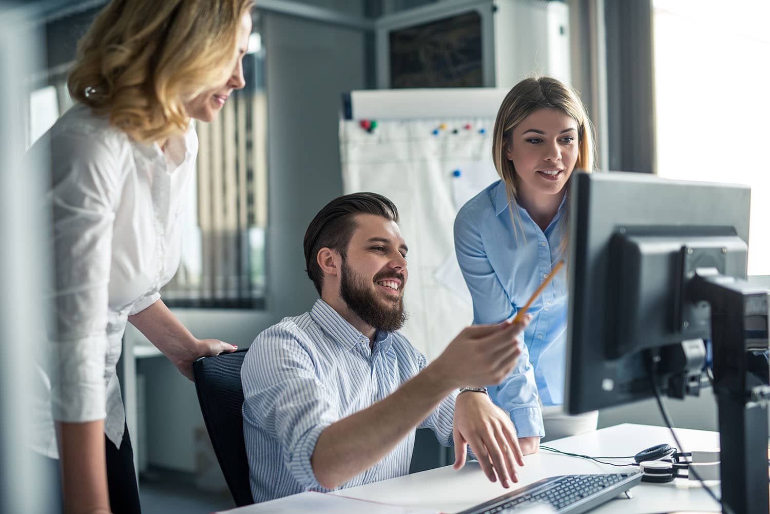 Team of colleagues working together in an office.